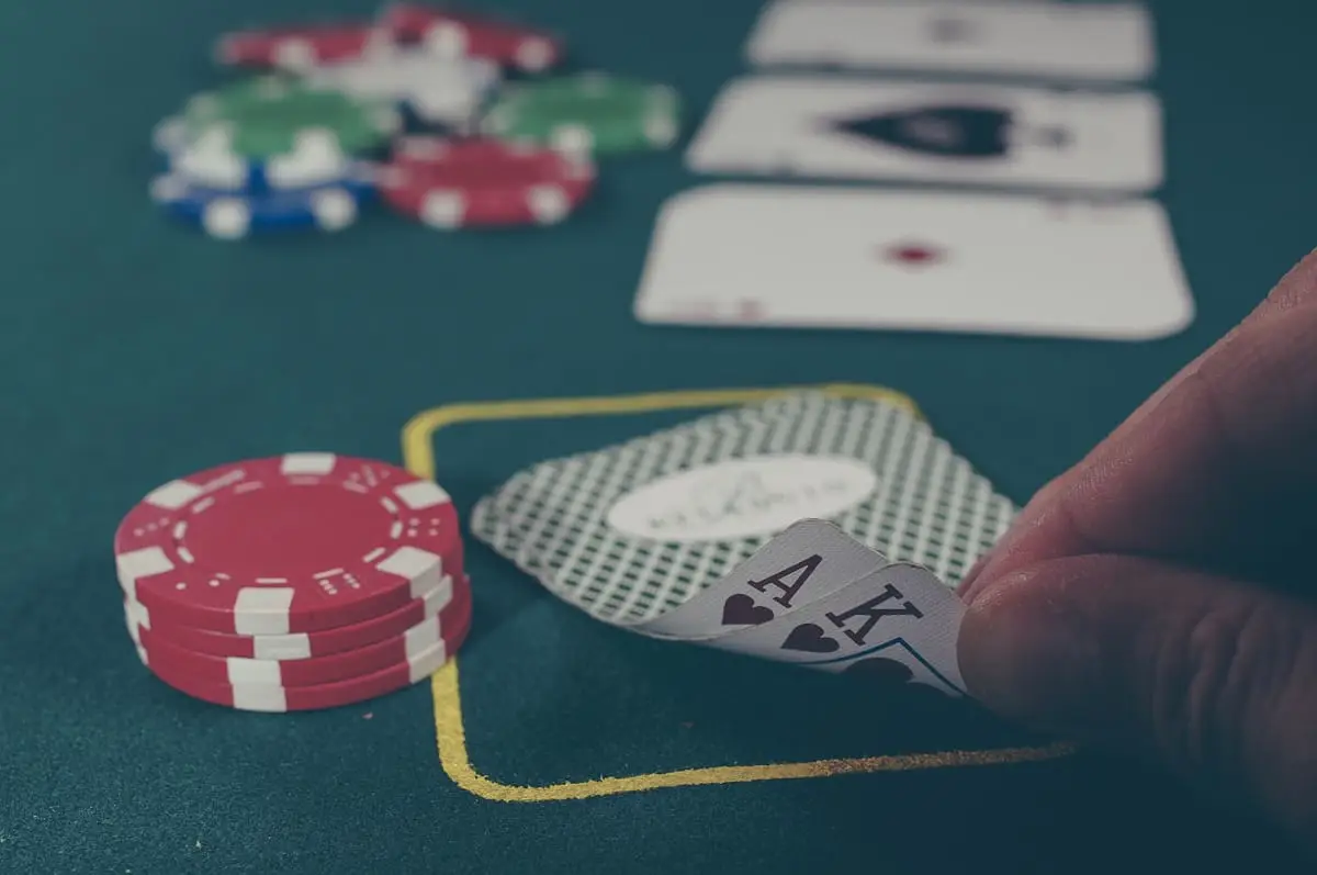 Poker chips and playing cards on a gaming table