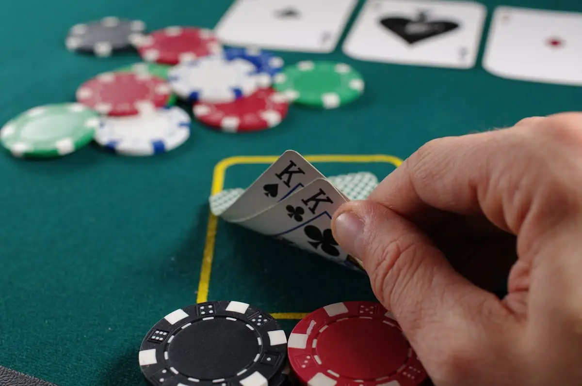 Poker chips and cards on green felt