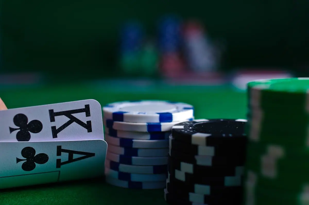 Poker hand with chips on green felt