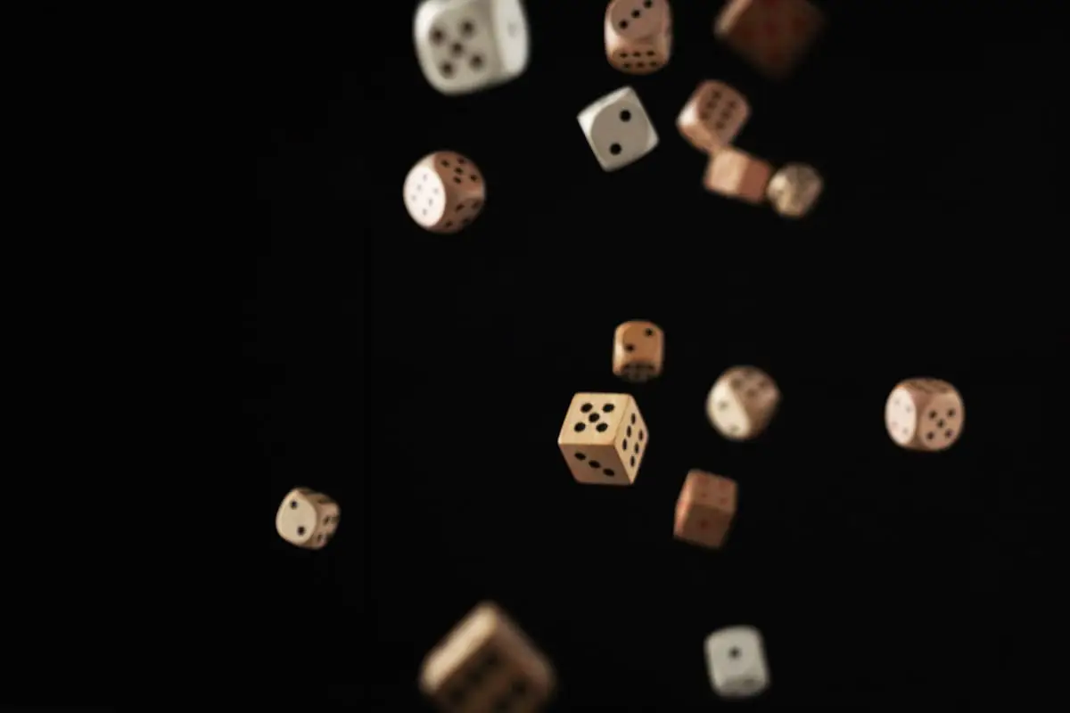 Dice suspended over a dark background