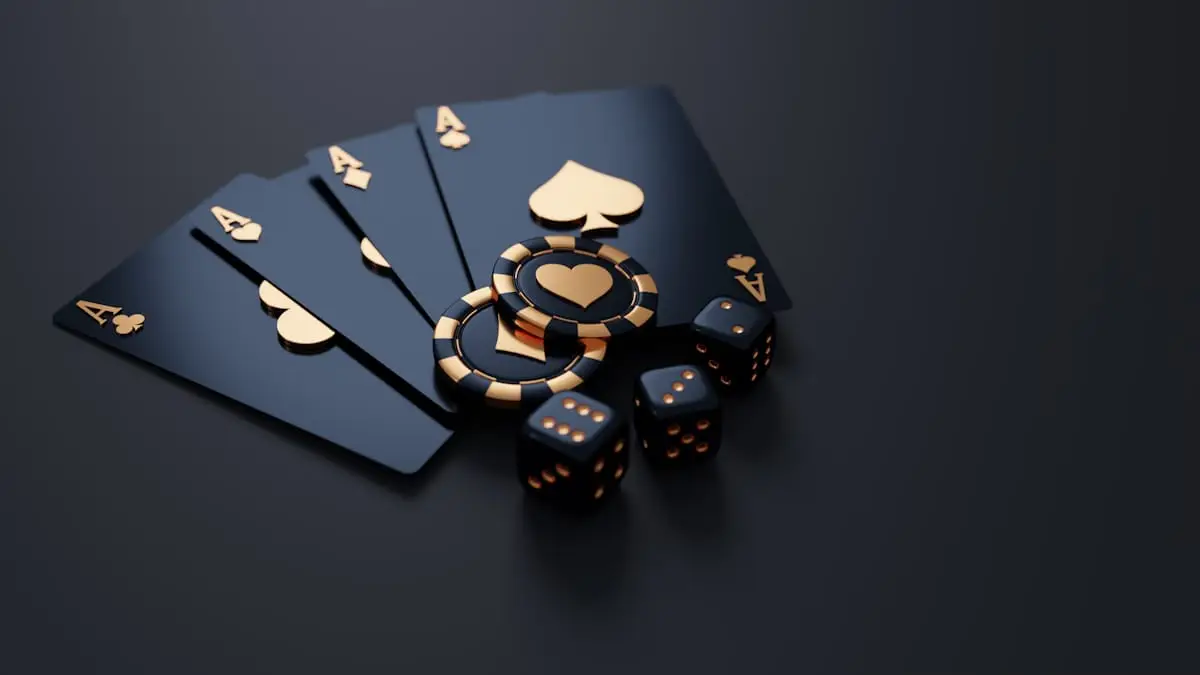 Playing cards and poker chips on a dark table