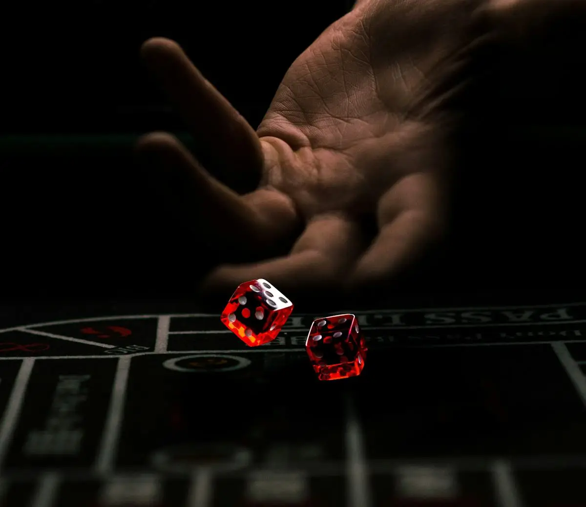 Red gaming dice in a hand